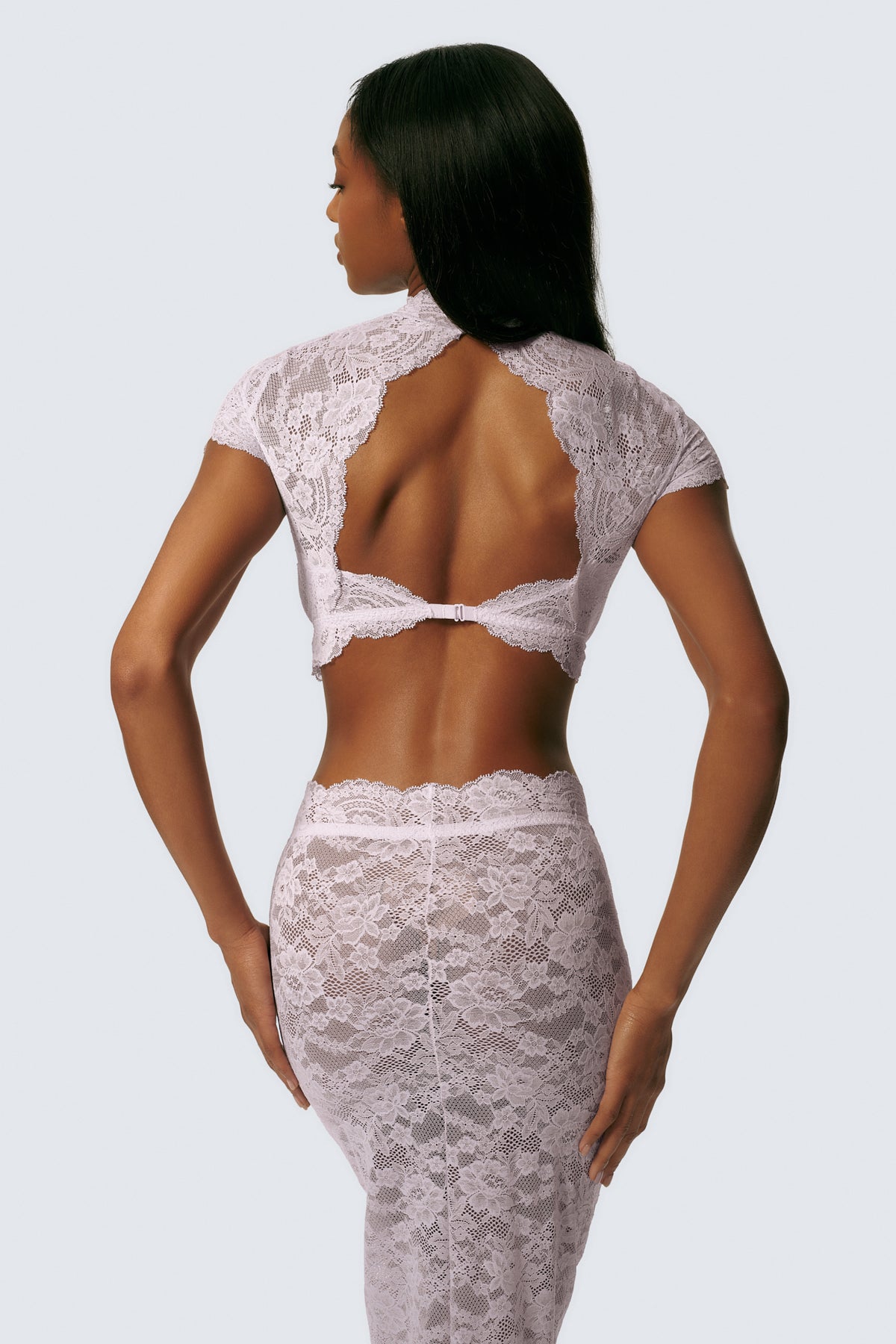 Angela is 5'11 and 30DDD and wears M on top and XS on the bottom