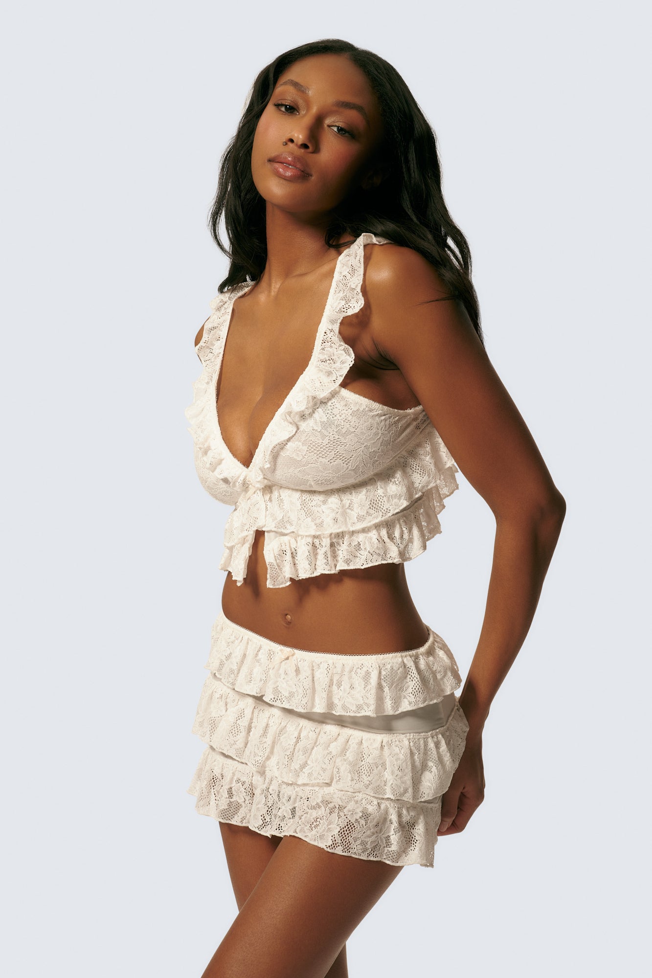 Angela is 5'11 and 30DDD and wears S on top and XS on the bottom