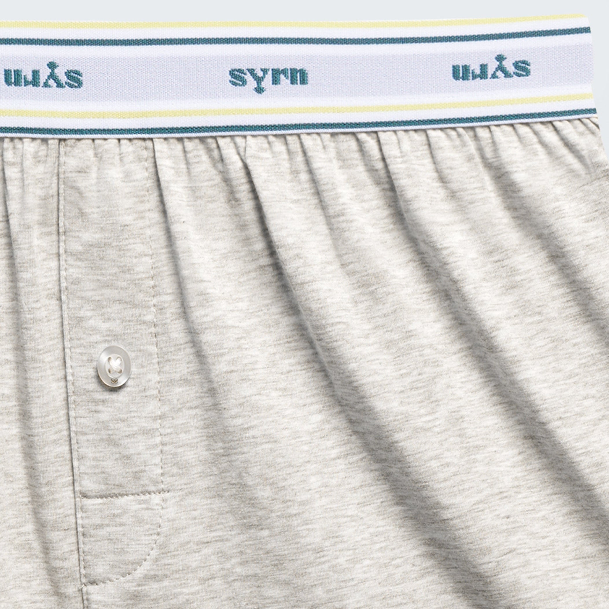 Close up of fly and SYRN waistband on gray knit boxers