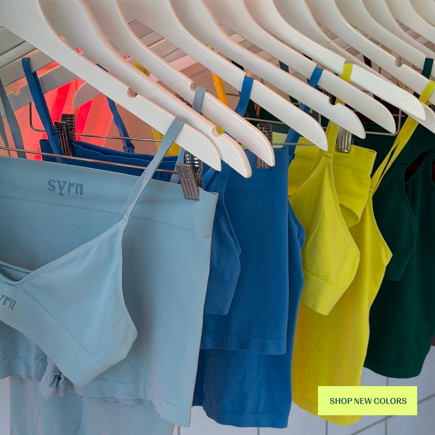 Colorful Do What Makes You Naked clothing on hangers